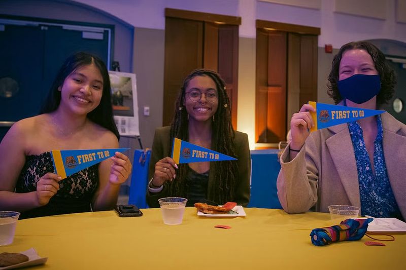 First to Go students sitting at a table