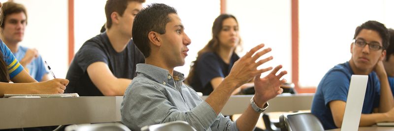 A student talking from the audience in a lecture hall